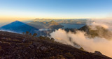 Fototapeta Góry - Panorama view of Lake Atitlan and volcano San Pedro early in the morning from peak of volcano Atitlan, Guatemala