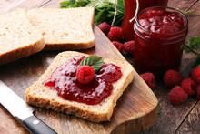 Fresh Raspberry Jam With Toast Or Bread For Breakfast.