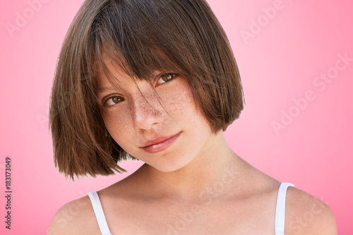 Thoughtful Little Child With Freckles Bobbed Hairstyle Looks