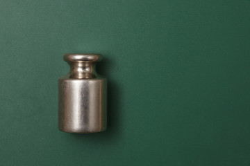 Calibration weight on green background