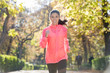 © Wordley Calvo Stock - attractive and happy runner woman in Autumn sportswear running a