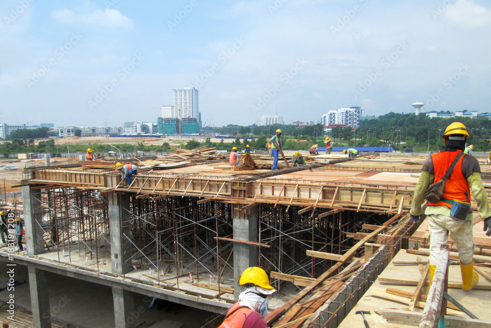 Timber Wwork Construction workers fabricating timber form work at the construction ...