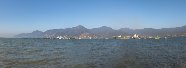 Wall Mural - Panoramic view of Downtown Sao Sebastiao Sea with Ilhabela on background   - Sao Sebastiao, Sao Paulo, Brazil