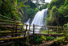 Beautiful Waterfall In Northern Thailand, Name Pha Dok Siew Waterfall In Doi Intanon National Park With Bamboo Bridge