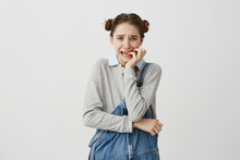 Woman In Jeans Jumpsuit Biting Her Nails Feeling Fear Looking On Camera In Stress. Female Business Beginner Going Through Troubles Worrying About Her Failure. Human Emotions