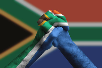 Sticker - Clasped hands patterned with the South africa flag, multi purpose concept - isolated on flag background