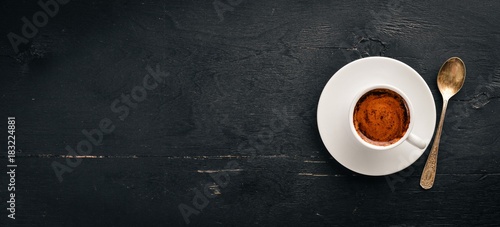 Cuadros en Lienzo A cup of espresso coffee on a dark wooden background