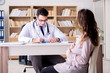 © Elnur - Pregnant woman visiting doctor for consultation
