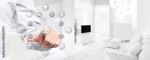 Fotomural smart home automation hand touch screen with symbols on interior room background
