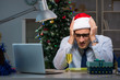 © Elnur - Businessman working late on christmas day in office