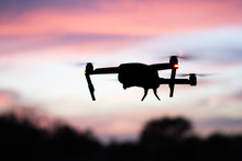 Silhouette Of Drone With Twilight Sky Background