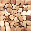 Small polished wooden pieces texture background. Natural crosscut cherry wood tiles pattern