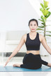 © sirikorn - Asian beautiful sports woman performs the exercises at home .