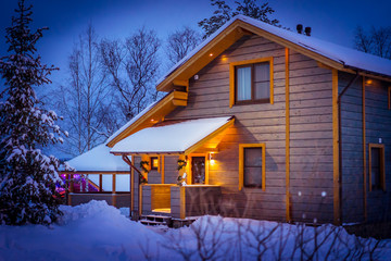 Country house in the winter. Cottage in winter.