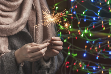 Bengal lights in hands. Holiday of Christmas, New Year.