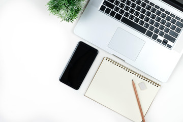 Wall Mural - Business office work desk table with computer laptop , note and stationery on white table background include copyspace for add text or graphic