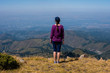 © allenkayaa - Woman looks afar in the mountains near Almaty, Kazakhstan