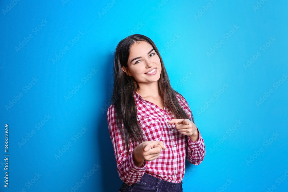 Beautiful smiling woman on color background
