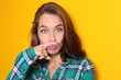 © Africa Studio - Young woman with funny grimace on color background