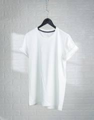 Set blank t-shirt on wooden table