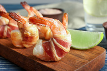Shrimp Wrapped In Bacon On Wooden Board, Closeup