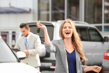 Sticker - Happy customer with key near new car outdoors