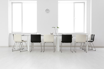 Canvas Print - Modern office interior with large table and chairs