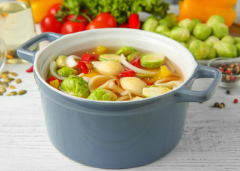 Sticker - Vegan soup with Brussels sprouts in bowl on wooden table