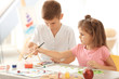© Africa Studio - Little children painting at table