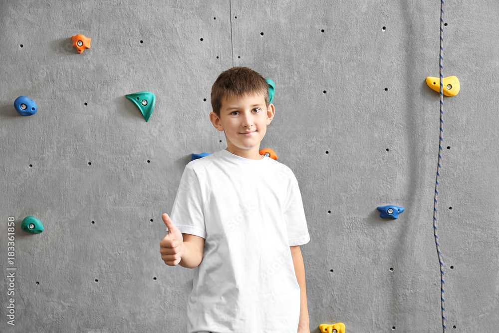 Young boy in climbing gym