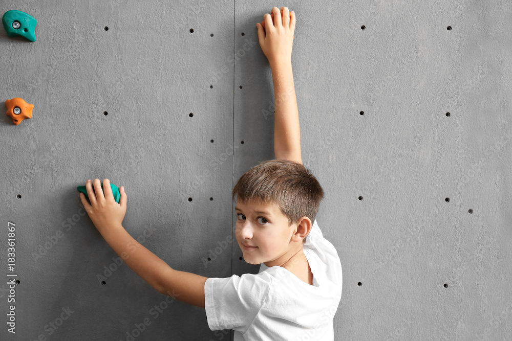 Young boy in climbing gym