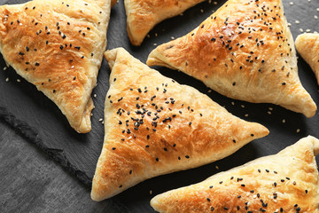 Sticker - Slate plate with delicious samosas, closeup