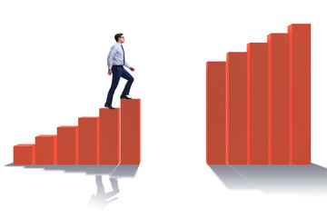 Businessman going up the bar chart in growth concept