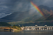 Bonneville Lock And Dam View In The Columbia River Gorge With Rainbow And Eagle Creek After Forest Fire. Hydroelectric Power Generation Structures Between The USA States Of Oregon And Washington.