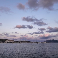 Sea view at sunset with port in the background