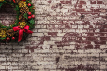 Christmas Wreath On  Brick Wall Background