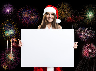 Christmas dressed woman holding a white panel