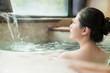 © PR Image Factory - charming girl stay in hot spring water