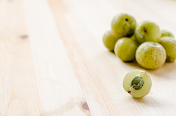 Indian Gooseberry: berry of high vitamin-c on the wooden background