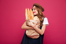 Young Lady Hug Pack With Baguettes And Enjoy Them Isolated