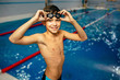 © Peakstock - young boy wearing swimming goggles