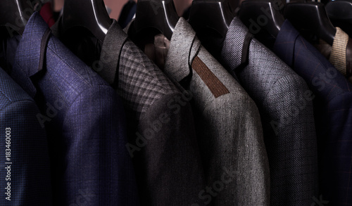 Fotografía Mens suits on hangers in different colors