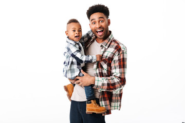 Sticker - Portrait of a happy african man holding his little son