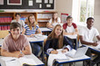 © Monkey Business - Portrait Of Students Sitting At Desks In Classroom