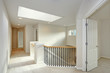 Second floor landing with skylight and staircase