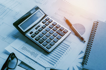 Fototapete - business accounting concept financial with calculator pen notbook on desk