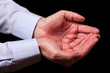 © StockPhotosArt - Mature male businessman hands together with empty palms up. Concept for man praying, prayer, faith, religion, religious, worship or giving, offering, begging, receiving. Black background.