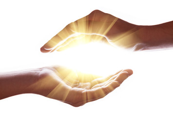 Woman hands protecting and containing bright, glowing, radiant, shining light. Emitting rays or beams expanding of center. Religion, divine, heavenly, celestial concept. White background copy space