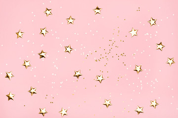 Poster - Golden stars glitter on pink background.