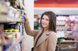 © Stocked House Studio - young woman shopping at supermarket